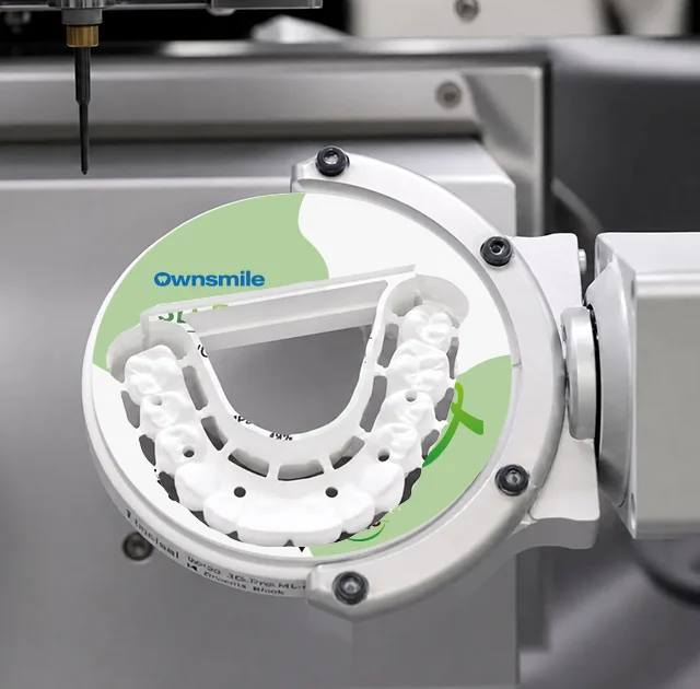 Dental milling machine cutting a zirconia full arch bridge